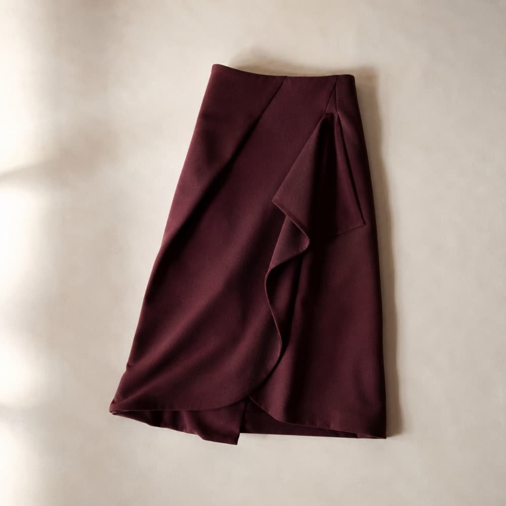 the burgundy skirt, photographed lying flat